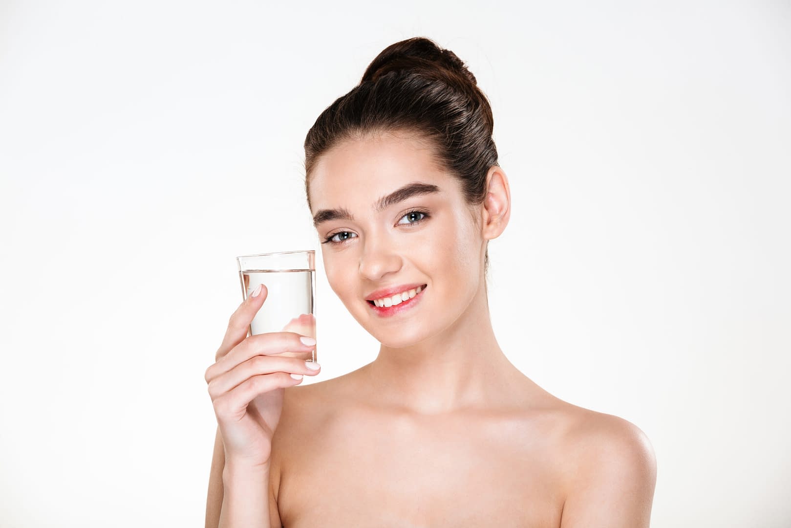horizontal picture happy healthy woman being half naked drinking minaral water from transparent glass with smile scaled